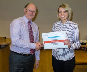 Pip receives her prize from Eric Jenkinson, Head of the coll